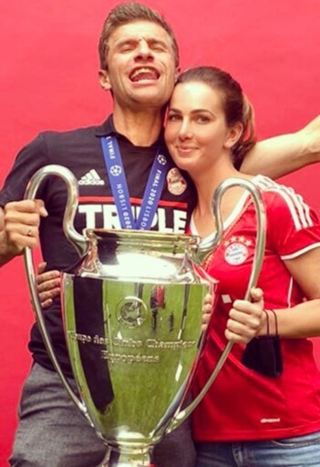 Lisa Muller and Thomas Muller with a trophy. 